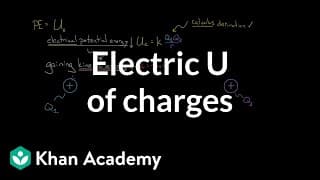 Electric potential energy of charges | Physics | Khan Academy